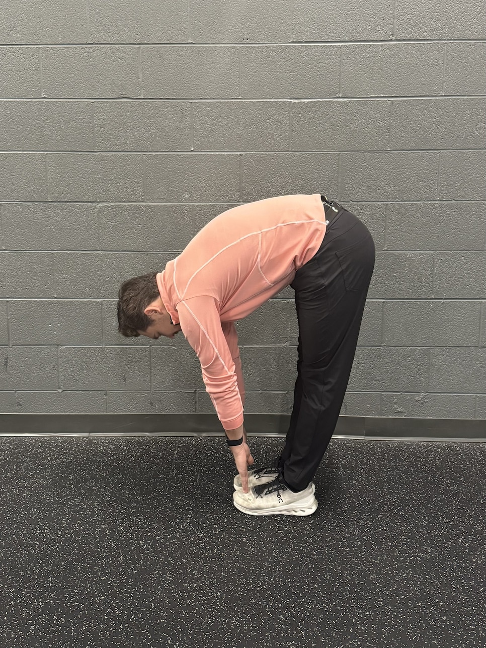 /content/dam/images/golfdigest/fullset/fitness-2025/toe touch 2 (side view).jpg